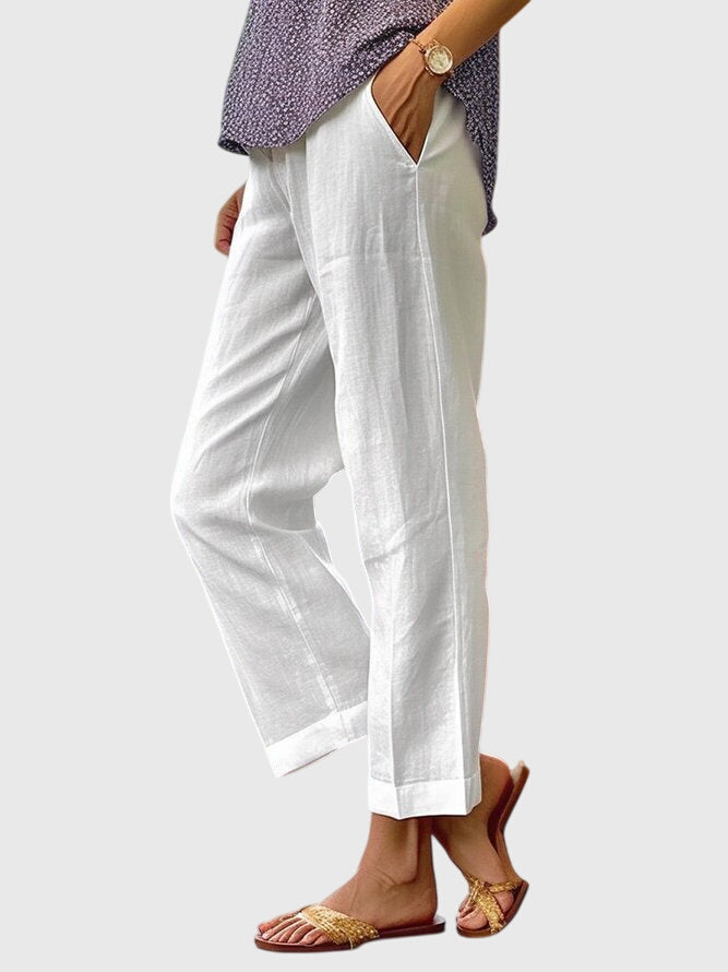 Elegante damesbroek in effen kleur met rechte pijpen, sierstiksel en discrete voorzak