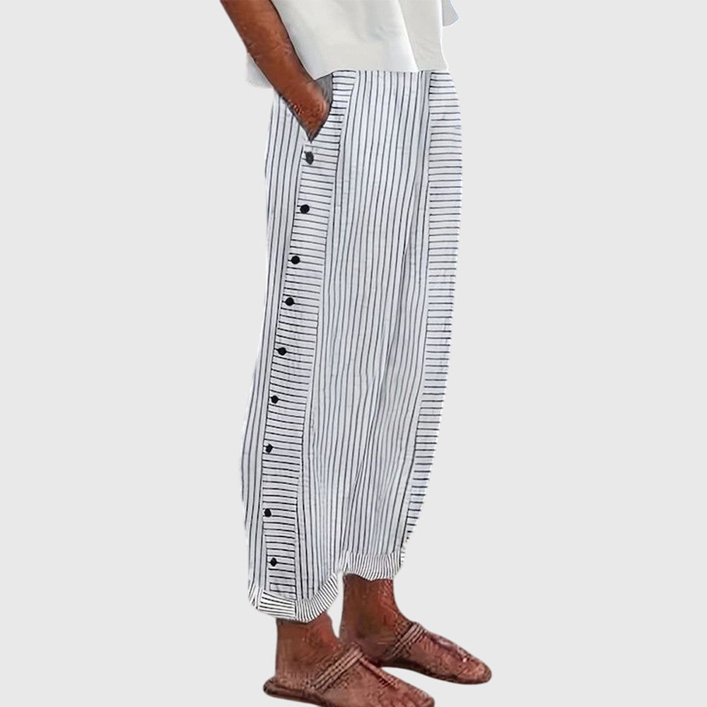 Elegante wijde damesbroek in neutrale kleur met elastische tailleband en soepel vallende pijpen