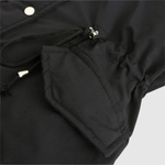 Asymmetrische dames jas van imitatieleer met schuine sluiting en diepe zakken