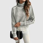 Minimalistische gebreide dames trui met fijne contrastdetails aan hals en boorden