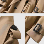 Lange damesjas met ceintuur in de taille en klassieke revers in effen kleur