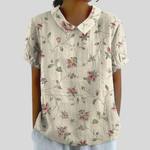 Elegante dames top met bloemenprint en nette polokraag, vloeiende pasvorm voor elk figuur