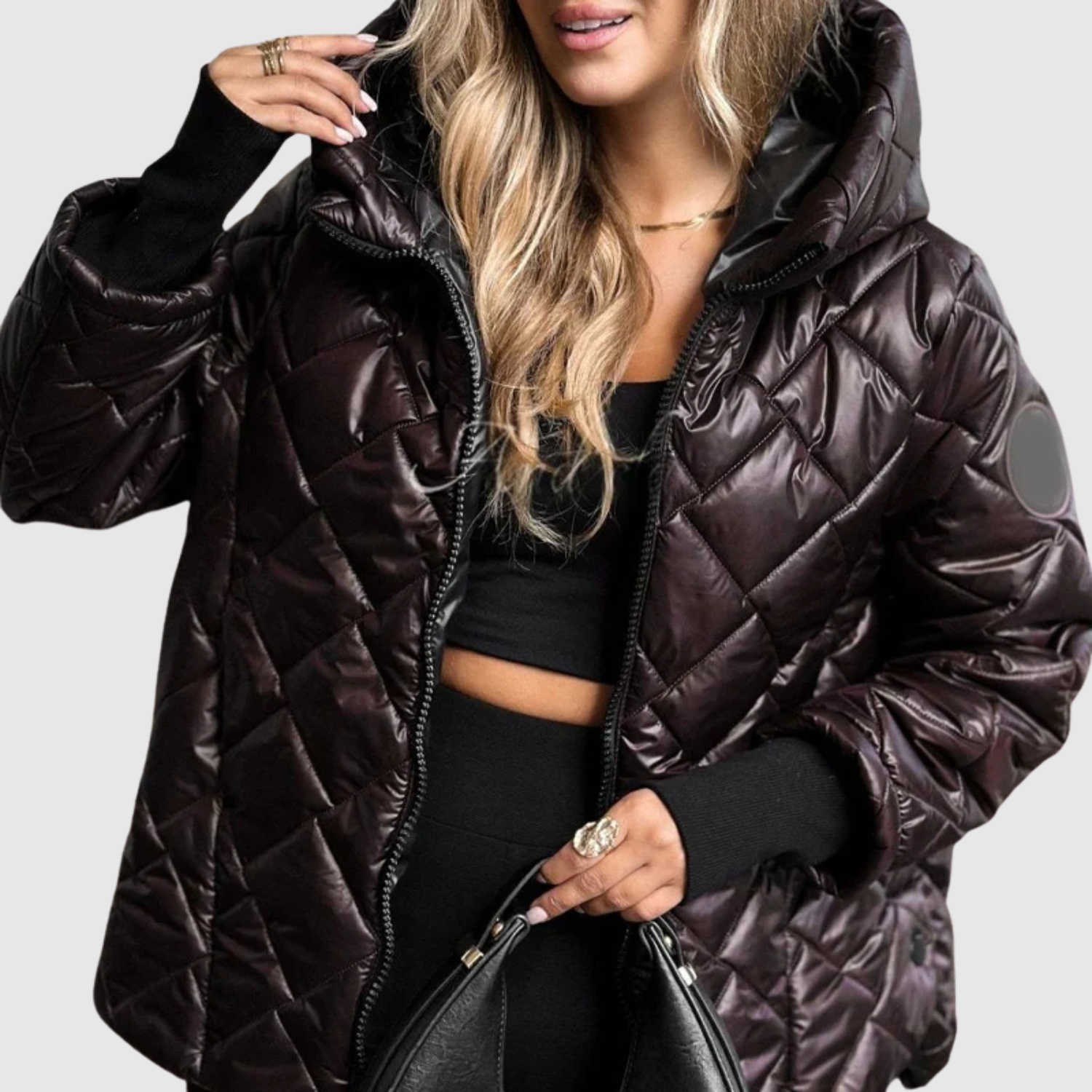 Elegante gewatteerde dames winterjas met slanke lijn, capuchon en diepe zakken
