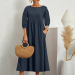 Elegante jurk met ronde hals, 3/4 mouwen, getailleerde taille en vloeiende rok