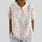 Elegante dames bloementop met polokraag, soepele snit en tijdloze bloemenprint