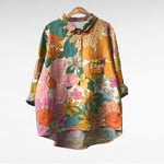 Lichte dames zomerblouse met lange mouwen en verfijnde artistieke print in ademende stof