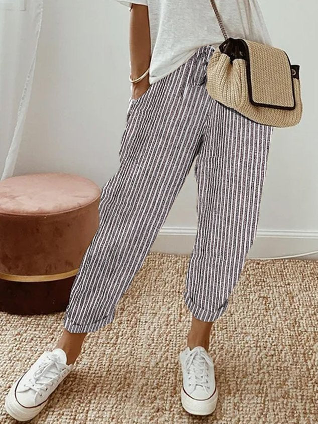 Elegante comfortbroek met zachte elastische taille, diepe zakken en soepel vallende pijpen