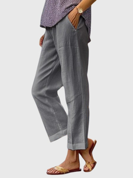 Elegante damesbroek in effen kleur met rechte pijpen, sierstiksel en discrete voorzak