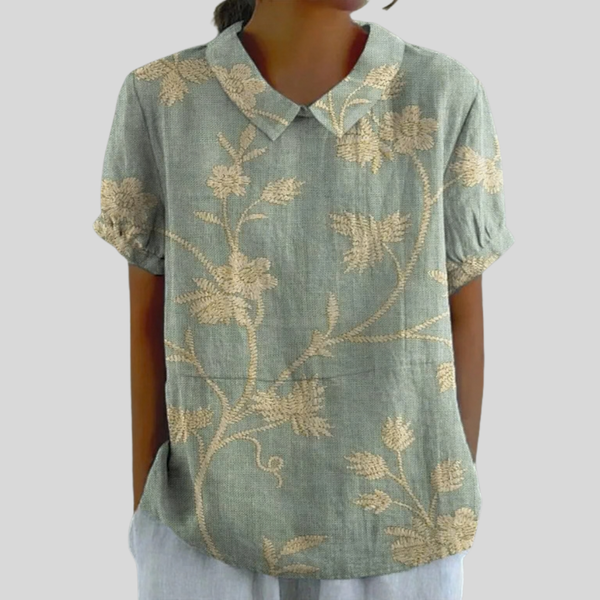 Elegante dames top met bloemenprint, verfijnde polokraag en soepel vallende snit