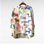 Elegante zomerblouse met kunstprint die soepel over het figuur valt