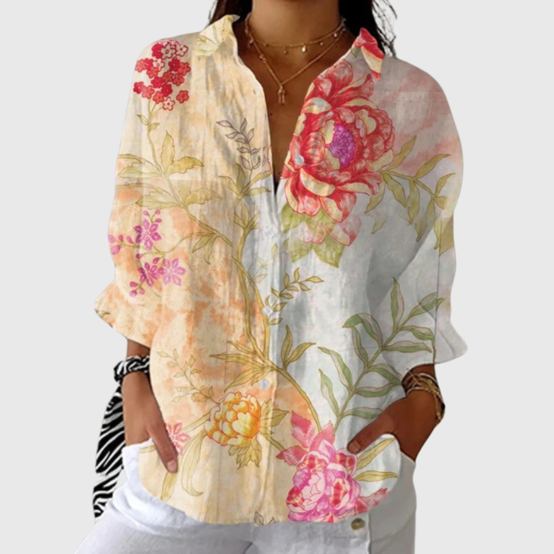 Lichte damesblouse met vrolijke zomerprint in zachte kleuren en lange mouwen