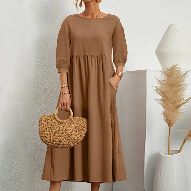 Elegante jurk met ronde hals, 3/4 mouwen, getailleerde taille en vloeiende rok