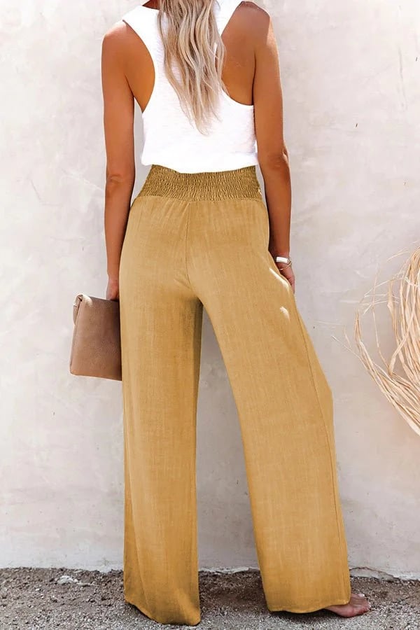 Relaxte broek met hoge taille, wijde pijpen en subtiele knopen in een neutrale tint