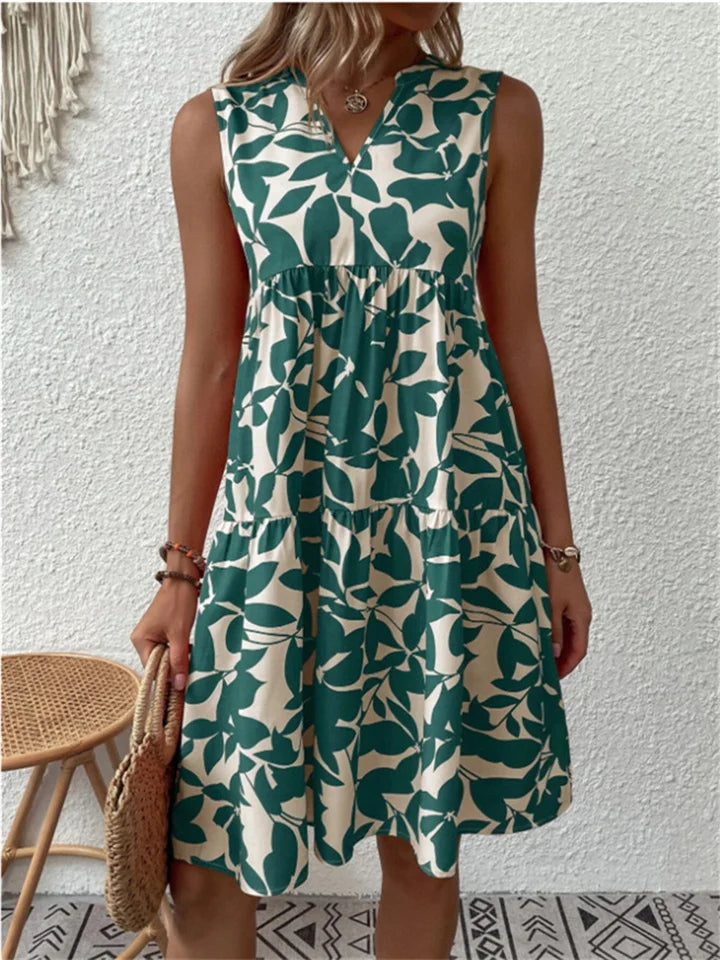 Mouwloze midi jurk met kleurrijke bloemenprint, V-hals en wijd uitlopende rok