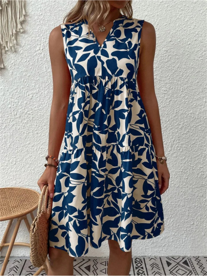 Mouwloze midi jurk met kleurrijke bloemenprint, V-hals en wijd uitlopende rok