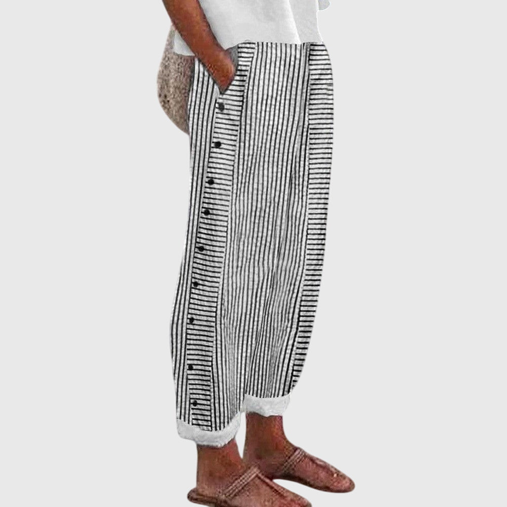 Elegante wijde damesbroek in neutrale kleur met elastische tailleband en soepel vallende pijpen