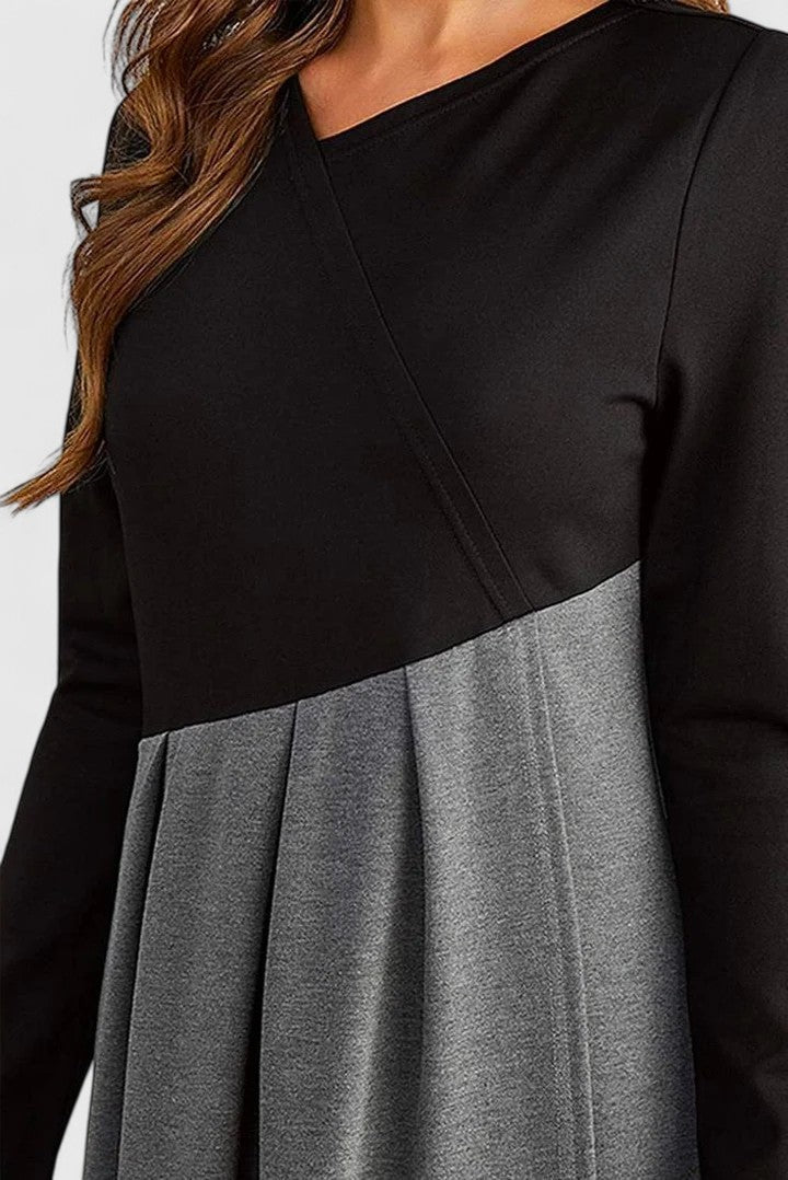 Elegante maxi jurk met lange mouwen en vloeiende rok in een rustige effen tint