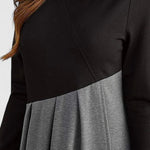 Elegante maxi jurk met lange mouwen en vloeiende rok in een rustige effen tint