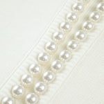 Floor vest met pareldetails