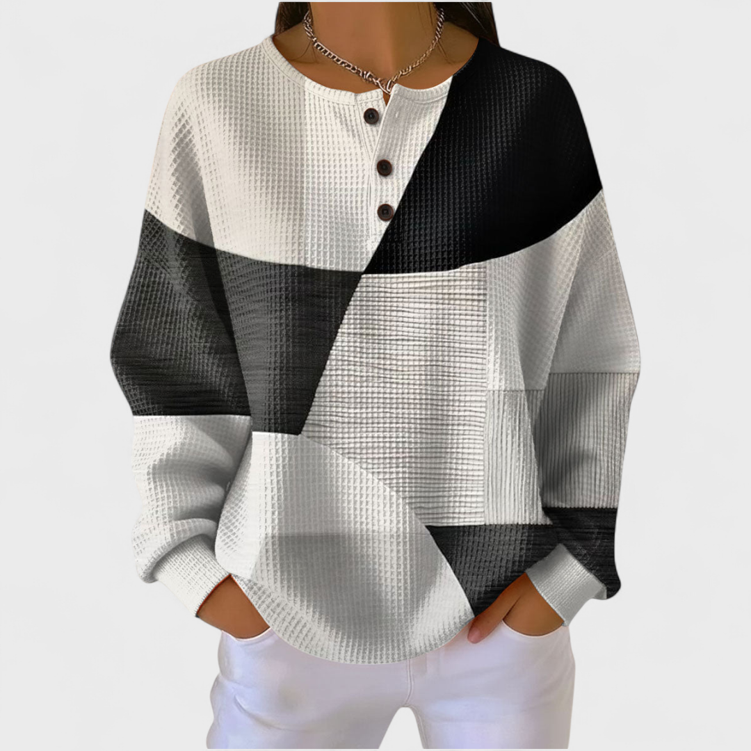Manon dames monochrome trui met kleurvlakken en wafelstructuur