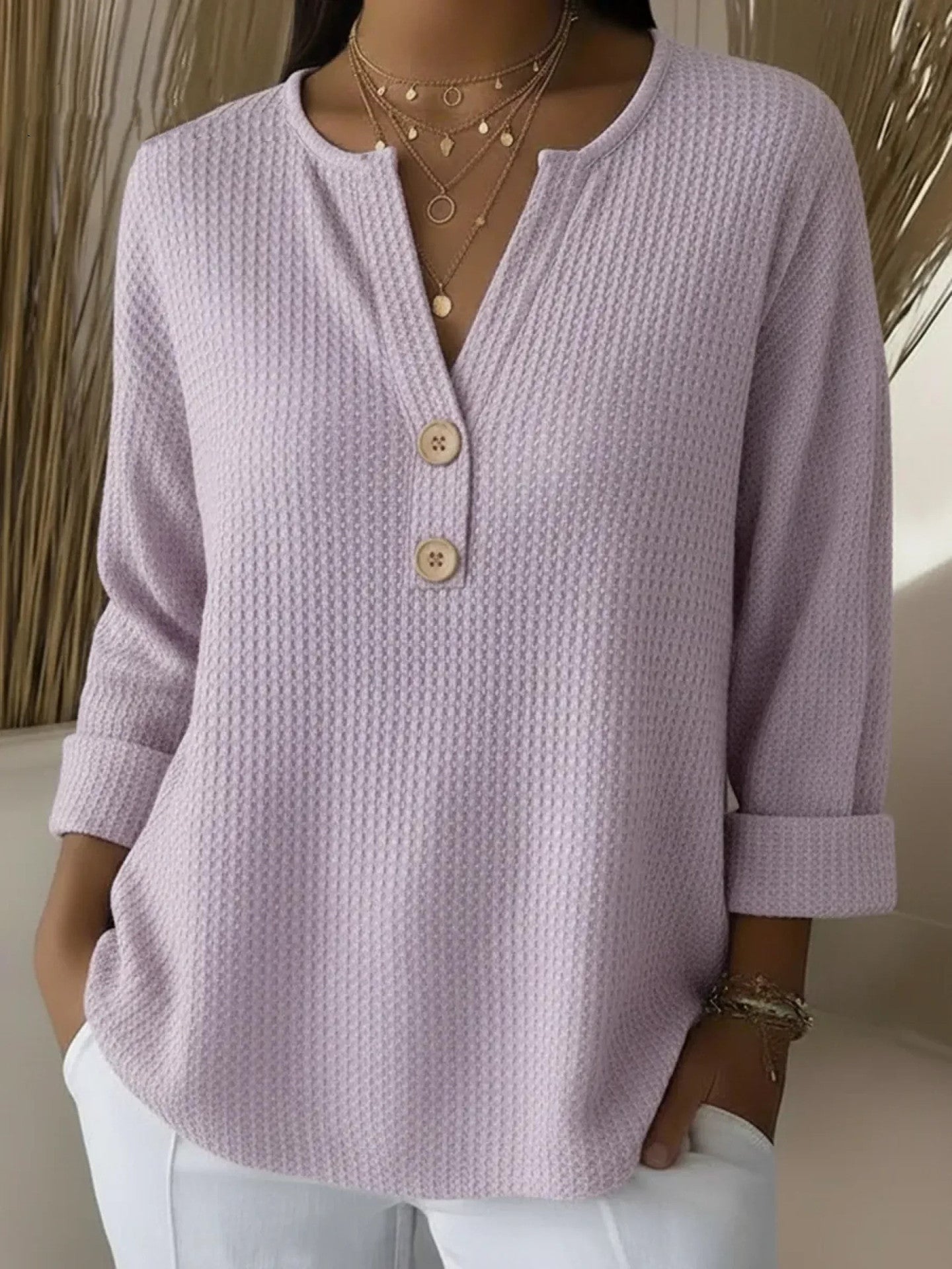Nelleke dames top met structuur en henley-knoopsluiting