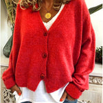 Gebreid vest met v-hals en knoopsluiting voor dames, los gedragen over een effen top
