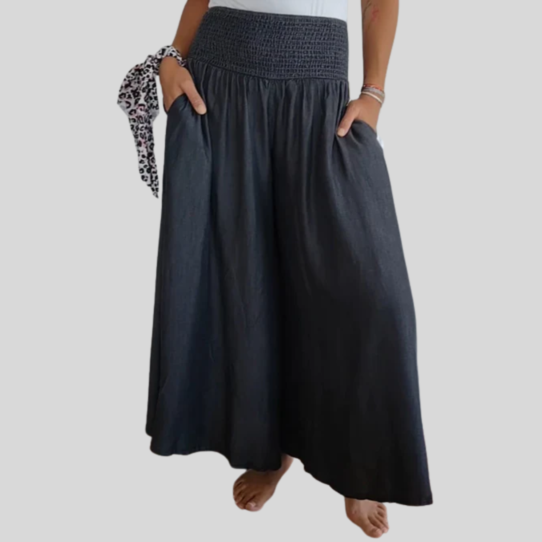 Wijde damesbroek in effen kleur met hoge elastische taille, brede pijpen en steekzakken