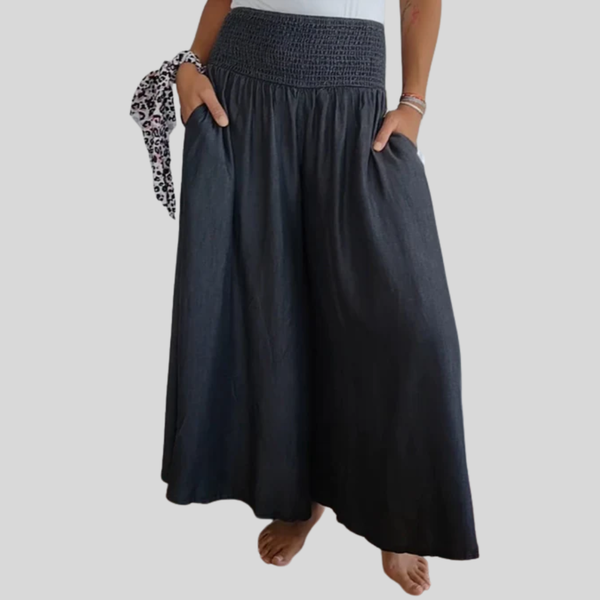 Wijde damesbroek in effen kleur met hoge elastische taille, brede pijpen en steekzakken