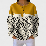 Bianca dames mosterdkleurige trui met abstracte print en wafelstructuur