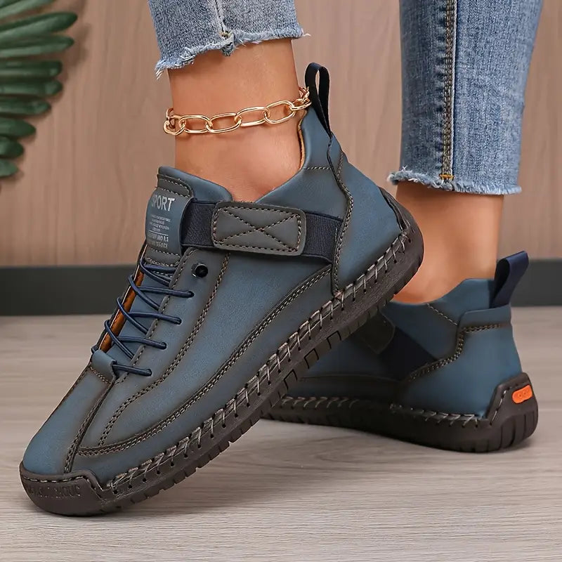 Orthopedische damessneakers van ademend leer met elastische zijpanelen en dikke EVA-zool