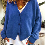 Gebreid vest met v-hals en knoopsluiting voor dames, los gedragen over een effen top