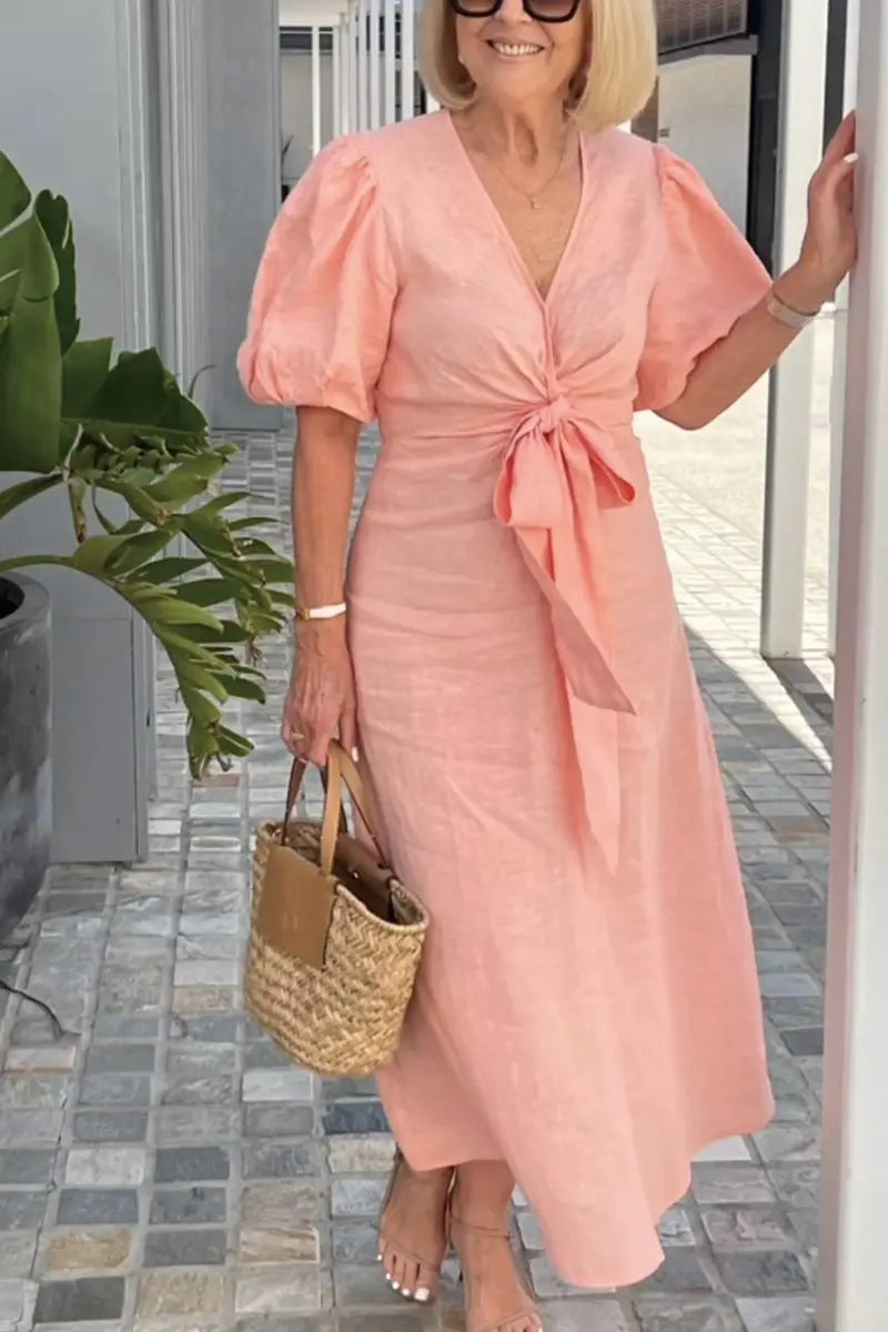 Elegante midi jurk voor dames met diepe V-hals, knoopdetail en pofmouwen