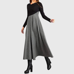 Elegante maxi jurk met lange mouwen en vloeiende rok in een rustige effen tint