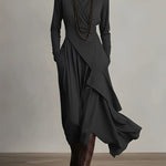 Elegante maxi jurk met zachte asymmetrische lagen en subtiele hoge halslijn