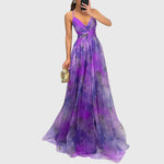 Lange maxi jurk met romantische bloemenprint, hoge taille en gekruiste bandjes