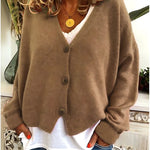 Gebreid vest met v-hals en knoopsluiting voor dames, los gedragen over een effen top
