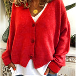 Gebreid vest met v-hals en knoopsluiting voor dames, los gedragen over een effen top