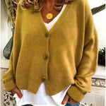 Gebreid vest met v-hals en knoopsluiting voor dames, los gedragen over een effen top