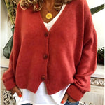 Gebreid vest met v-hals en knoopsluiting voor dames, los gedragen over een effen top