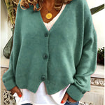 Gebreid vest met v-hals en knoopsluiting voor dames, los gedragen over een effen top