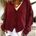 Gebreid vest met v-hals en knoopsluiting voor dames, los gedragen over een effen top