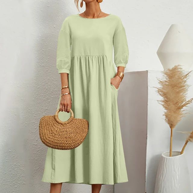 Elegante jurk met ronde hals, 3/4 mouwen, getailleerde taille en vloeiende rok