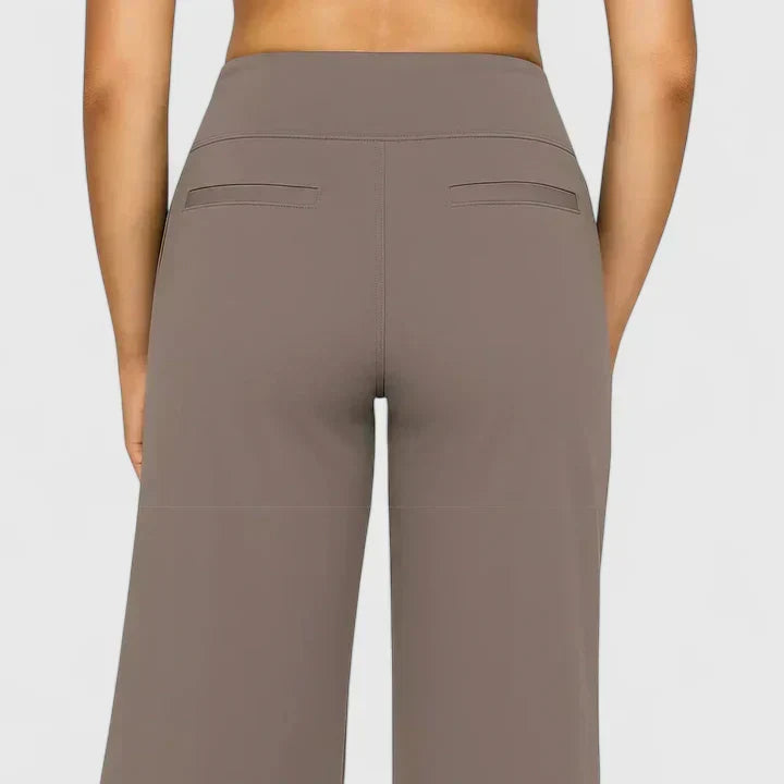 Elegante damesbroek in effen kleur met rechte pijpen, elastische tailleband en steekzakken