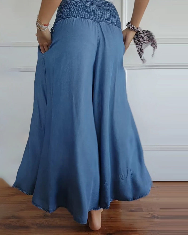 Wijde damesbroek in effen kleur met hoge elastische taille, brede pijpen en steekzakken