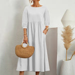 Elegante jurk met ronde hals, 3/4 mouwen, getailleerde taille en vloeiende rok