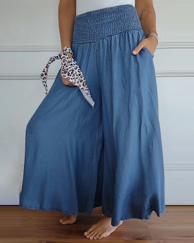 Wijde damesbroek in effen kleur met hoge elastische taille, brede pijpen en steekzakken