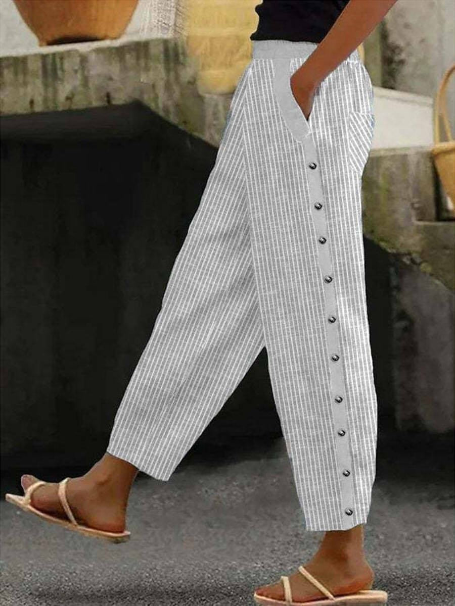 Luchtige gestreepte broek met sierknopen aan de zijkant en een comfortabele elastische taille
