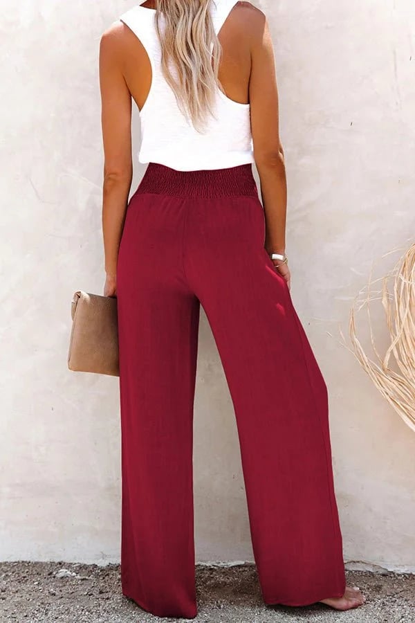 Relaxte broek met hoge taille, wijde pijpen en subtiele knopen in een neutrale tint