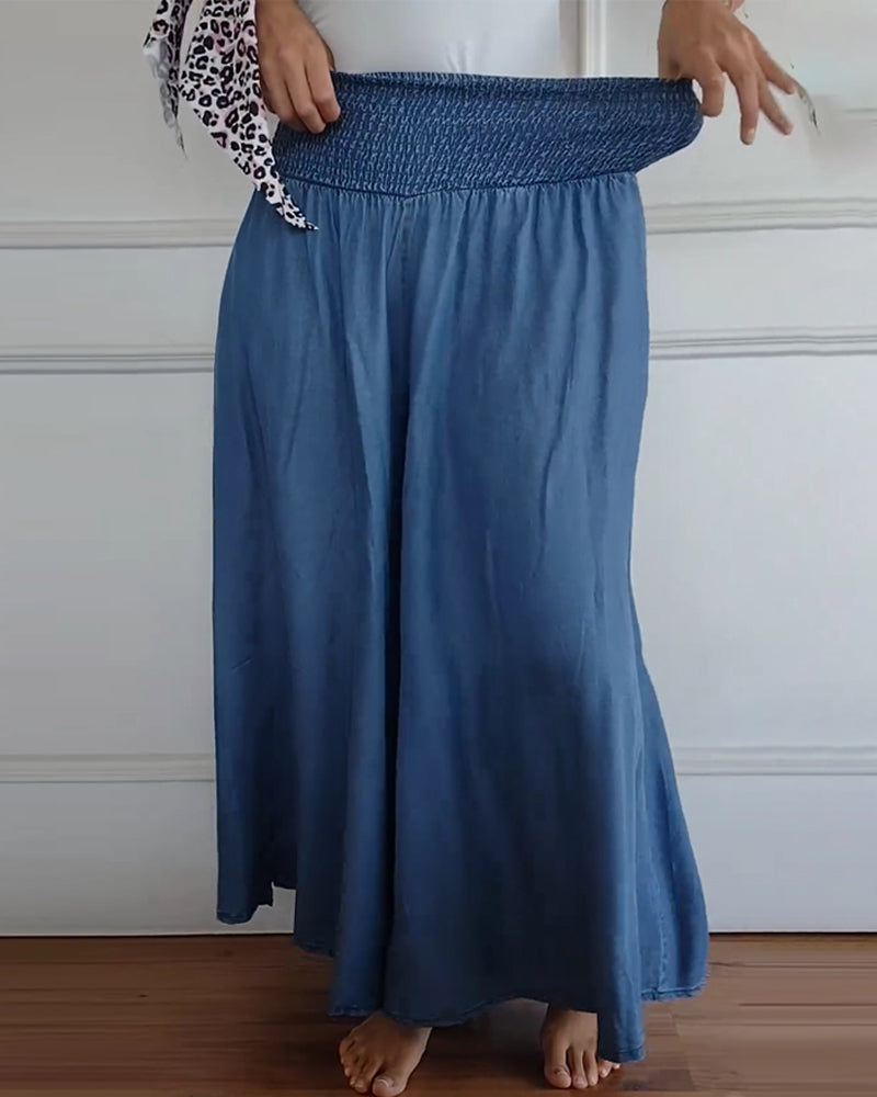 Wijde damesbroek in effen kleur met hoge elastische taille, brede pijpen en steekzakken