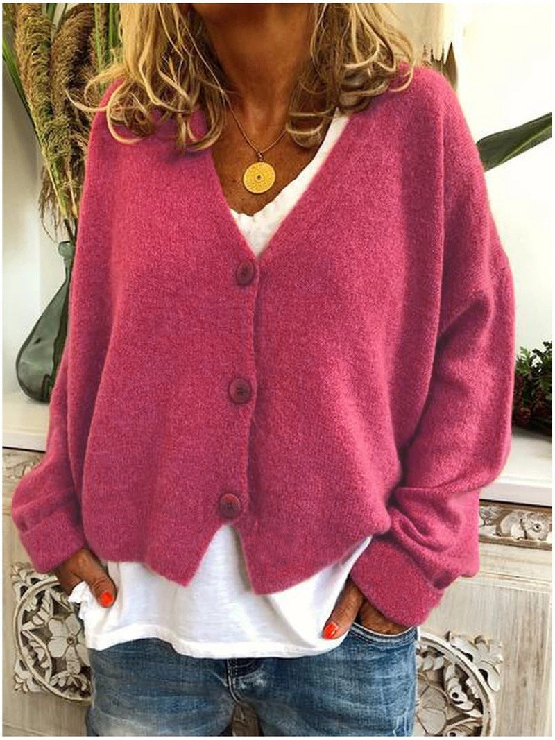 Gebreid vest met v-hals en knoopsluiting voor dames, los gedragen over een effen top